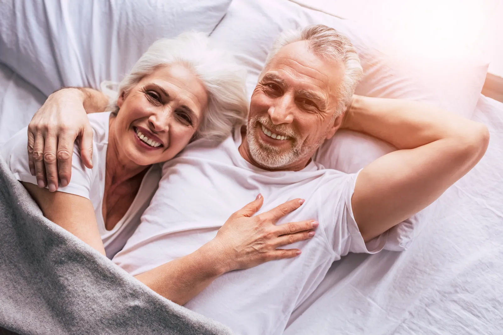 An older couple relaxed and happy together at home