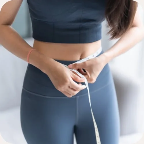 Someone measuring their waist